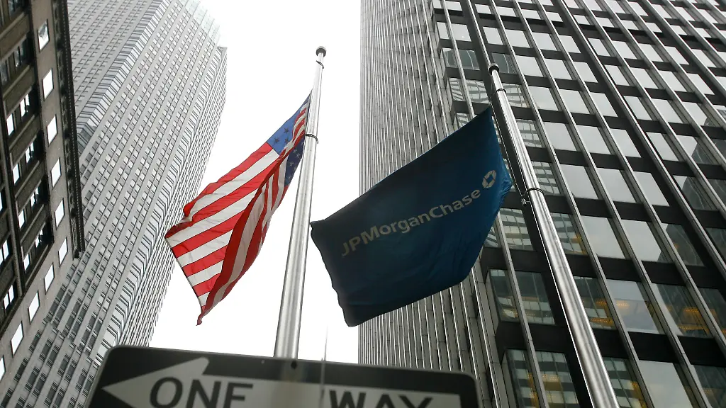 A-JP-Morgan-Chase-flag-flies-near-the-headquarters-for-Bear-Stearns-in-New-York-March-14-2008-Bear-Stearns-on-Friday-said-a-sudden-cash-crunch-forced-it-to-turn-to-the-Federal-Reserve-and-JPMorgan-Chase-for-emergency-funds-intensifying-fears-of-a-widening-global-credit-crisis-and-driving-its-shares-down-as-much-as-half