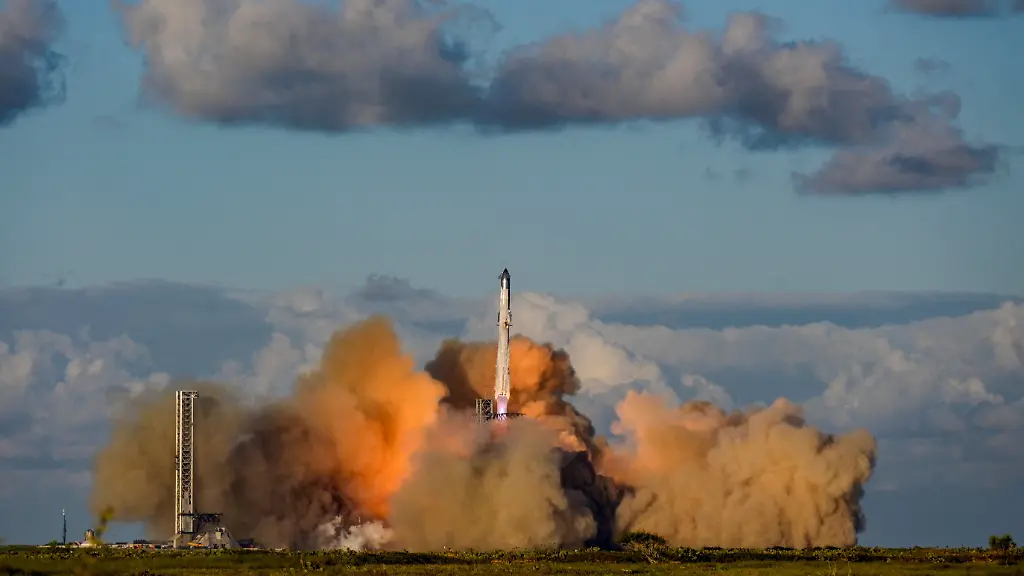 FILE-PHOTO-A-SpaceX-Super-Heavy-booster-carrying-the-Starship-spacecraft-lifts-off-on-its-11th-test-flight-at-the-company-s-launch-pad-in-Starbase-Texas-U-S-October-13-2025