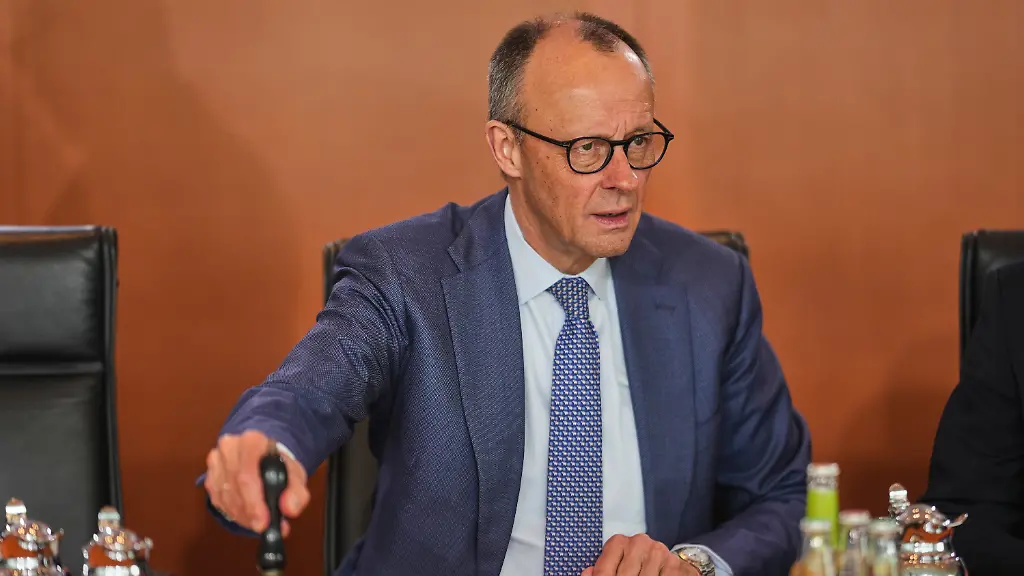 German-Chancellor-Friedrich-Merz-rings-the-bell-as-he-starts-the-cabinet-meeting-at-the-chancellery-in-Berlin-Germany-Wednesday-April-1-2026
