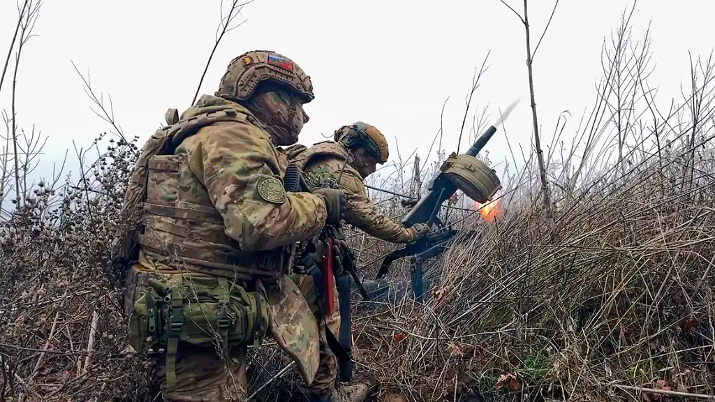 In-this-image-made-from-video-provided-by-Russian-Defense-Ministry-Press-Service-on-Tuesday-March-31-2026-Russian-soldiers-fire-a-grenade-launcher-towards-Ukrainian-positions-on-an-undisclosed-location-in-Ukraine