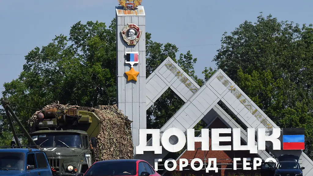 A-military-truck-rides-past-a-road-sign-reading-Donetsk-in-the-city-of-Donetsk-Russian-controlled-Ukraine-on-July-17-2025-amid-the-ongoing-Russian-Ukrainian-conflict