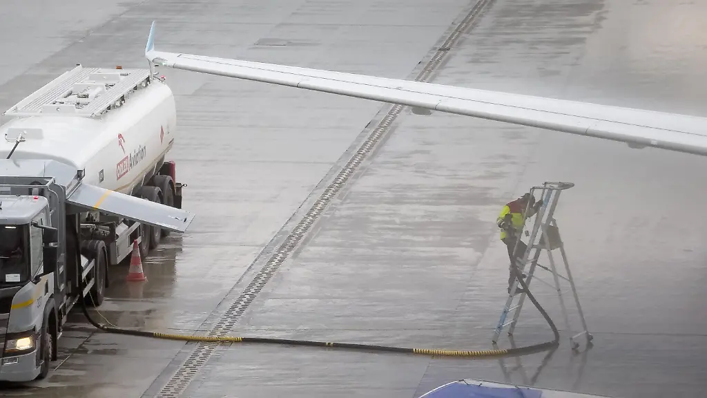 An-Orlen-Aviation-fuel-truck-and-a-ground-handling-worker-are-seen-during-aircraft-refueling-next-to-a-Eurowings-Airbus-A319-aircraft-at-Krakow-Airport-in-Krakow-Poland-on-May-21-2026