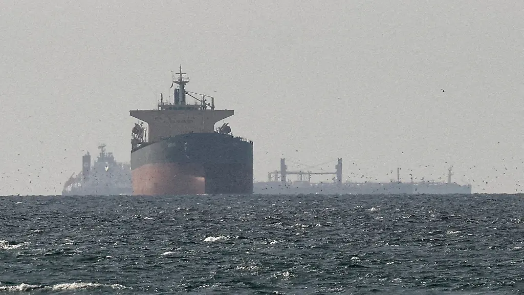 FILE-PHOTO-Cargo-ships-in-the-Gulf-near-the-Strait-of-Hormuz-as-seen-from-northern-Ras-al-Khaimah-near-the-border-with-Oman-s-Musandam-governance-amid-the-U-S-Israeli-conflict-with-Iran-in-United-Arab-Emirates-March-11-2026