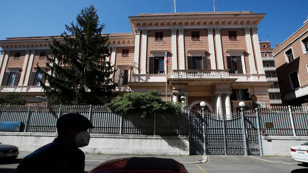 A-man-walks-past-the-Russian-Embassy-in-Rome-Wednesday-March-31-2021-Italy-has-ordered-two-Russian-Embassy-officials-expelled-and-arrested-an-Italian-Navy-captain-on-spying-charges-after-police-caught-the-Italian-allegedly-giving-classified-documents-to-one-of-the-Russians-in-exchange-for-money