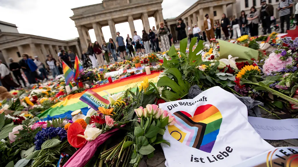An-advertisement-from-the-city-administration-reading-If-it-doesn-t-matter-who-you-love-than-you-belong-here-is-seen-by-Potsdamer-Platz-close-to-the-place-where-two-days-before-a-car-ramming-attack-killed-one-person-and-injured-29-during-the-CSD-parade-in-Berlin-Germany-on-July-27-2026-German-police-announced-on-July-26-that-they-had-shot-and-killed-the-main-suspect-in-what-authorities-describe-as-an-attack-with-an-Islamist-background-The-attack-happened-around-10-PM-on-July-25-targeting-the-LGBTQ-pride-parade-killing-one-woman-and-wounding-29-other-people