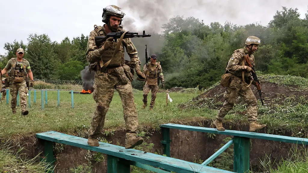 In-this-photo-provided-by-Ukraine-s-65th-Mechanized-Brigade-press-service-soldiers-practice-military-skills-at-a-training-ground-near-the-frontline-in-the-Zaporizhzhia-region-Ukraine-Friday-July-24-2026