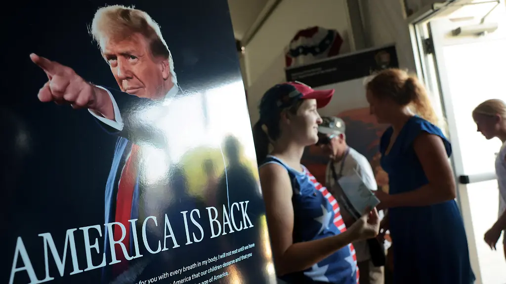 People-are-greeted-by-a-poster-of-U-S-President-Donald-Trump-at-the-U-S-Department-of-Agriculture-USDA-display-at-the-Great-American-State-Fair-celebrating-the-250th-anniversary-of-U-S-independence-in-Washington-D-C-U-S-July-2-2026