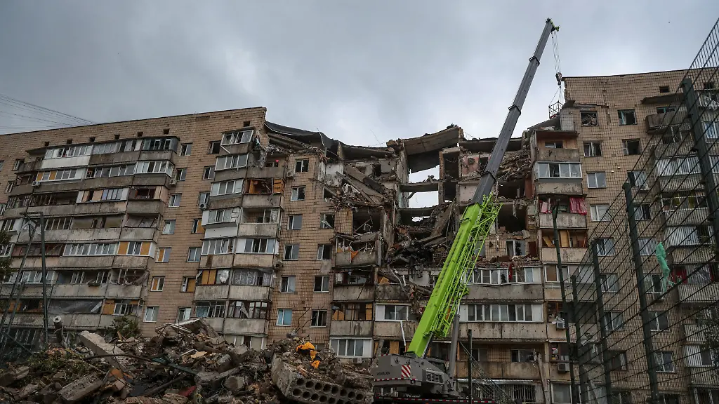 Rescuers-use-a-crane-to-remove-debris-while-they-work-at-the-site-of-an-apartment-building-which-was-hit-during-Russian-missile-and-drone-strikes-amid-Russia-s-attack-on-Ukraine-in-Kyiv-Ukraine-July-6-2026
