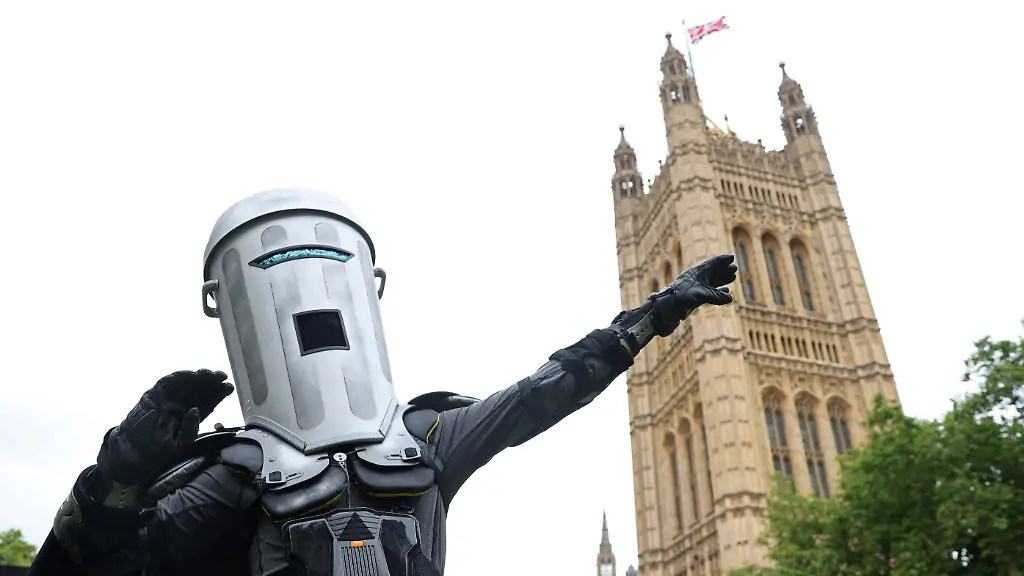 Satirical-political-character-Count-Binface-poses-during-an-interview-with-Reuters-ahead-of-challenging-UK-Prime-Minister-Rishi-Sunak-for-the-parliamentary-seat-of-Richmond-and-Northallerton-in-the-upcoming-general-election-on-July-4-outside-of-the-Houses-of-Parliament-in-London-Britain-July-2-2024