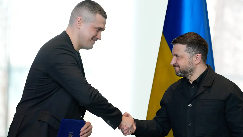 Ukraine-s-President-Volodymyr-Zelenskyy-shakes-hands-with-Ukraine-Defence-Minister-Mykhailo-Fedorow-during-a-signing-ceremony-at-the-German-Ukrainian-government-consultations-in-Berlin-Germany-Tuesday-April-14-2026