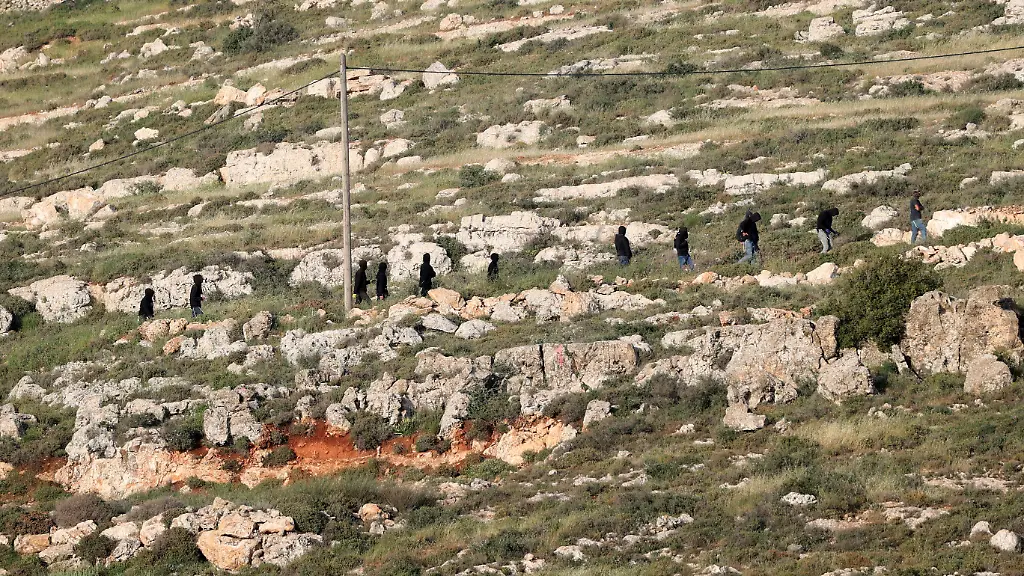 WEST-BANK-PALESTINE-APRIL-27-Israeli-settlers-are-seen-in-the-village-of-Jalud-south-of-Nablus-West-Bank-Palestine-on-April-27-2026-A-group-of-settlers-under-the-protection-of-Israeli-soldiers-attacked-Palestinians-and-their-homes-with-stones-and-Molotov-cocktails-leading-to-property-damage-and-the-evacuation-of-usable-items-from-affected-houses
