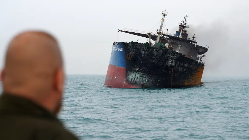 A-foreign-tanker-carrying-Iraqi-fuel-oil-damaged-after-catching-fire-in-Iraq-s-territorial-waters-following-unidentified-attacks-that-targeted-two-foreign-tankers-according-to-Iraqi-port-officials-near-Basra-Iraq-March-12-2026