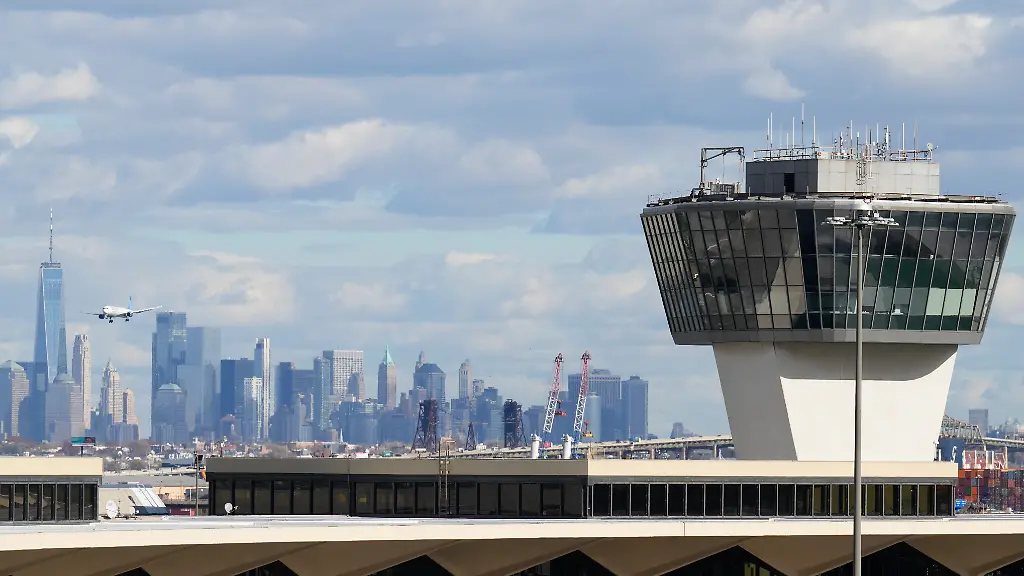 The-New-York-City-skyline-is-seen-behind-an-air-traffic-control-tower-at-Newark-International-Airport-in-Newark-N-J-Thursday-Nov-6-2025
