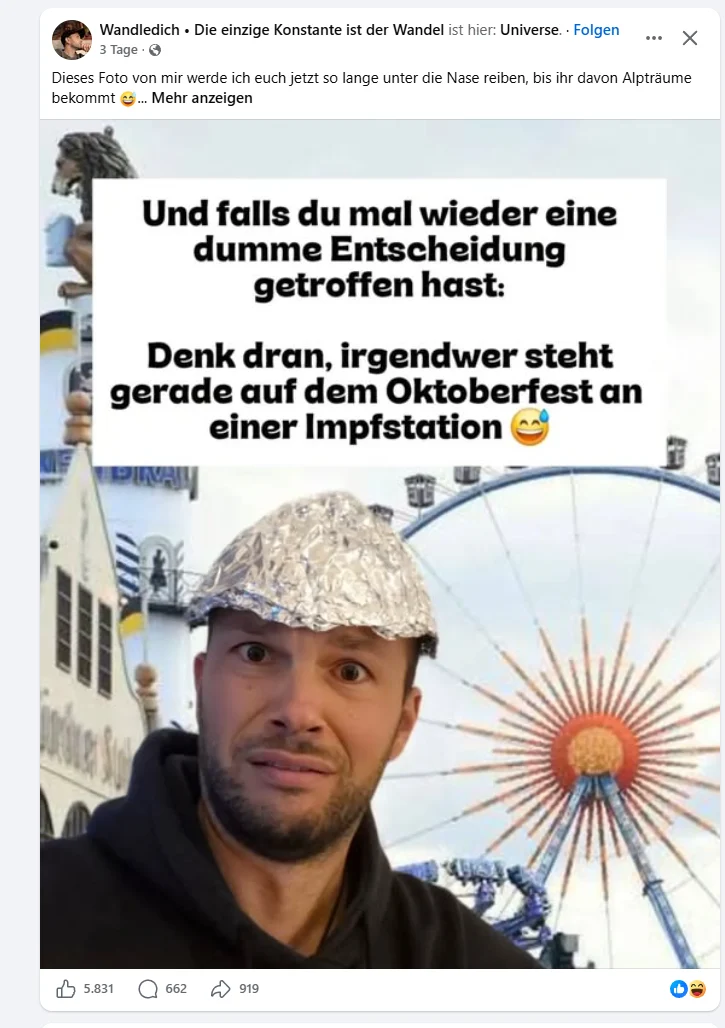 Aluhut vor dem Riesenrad